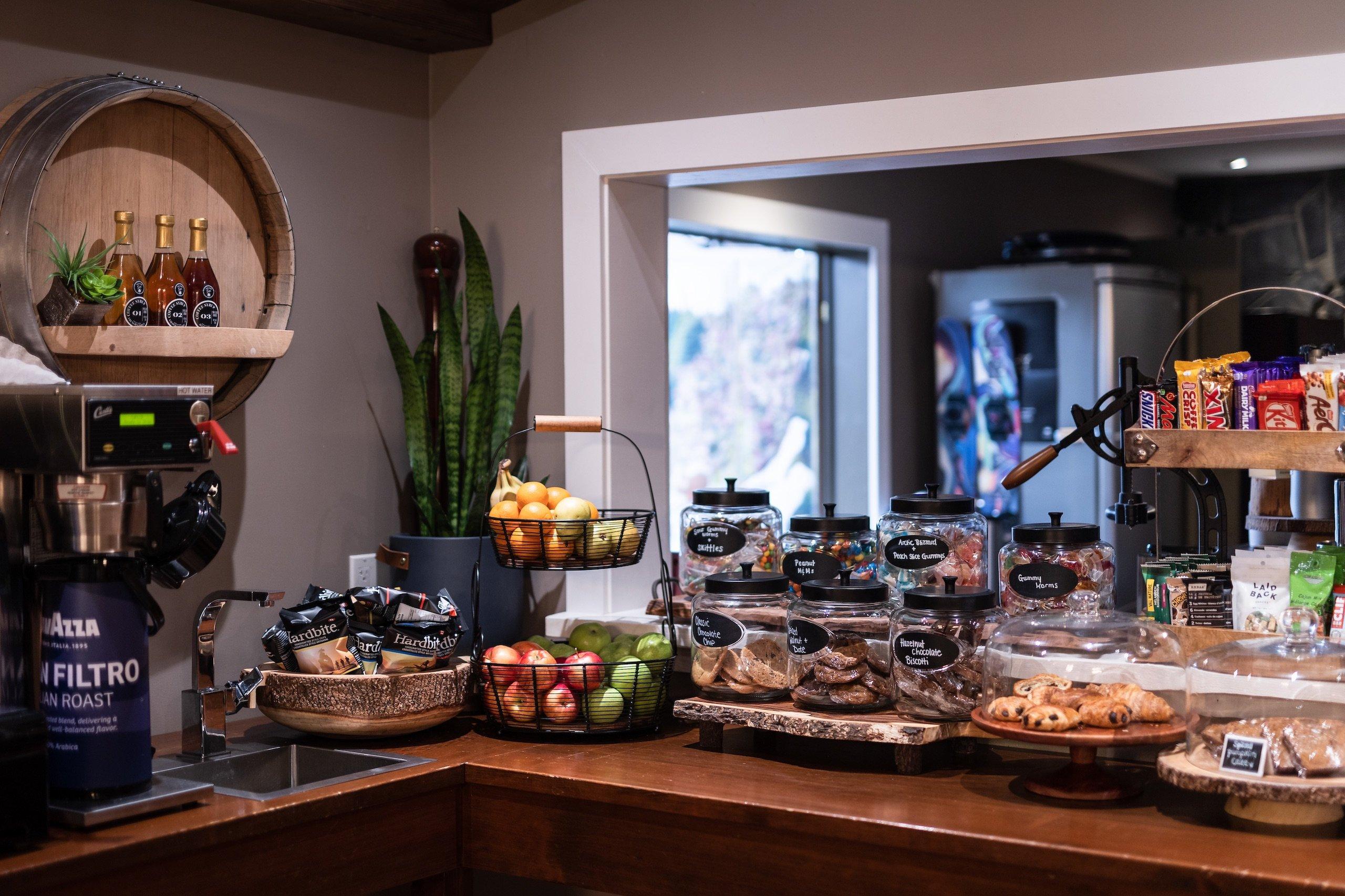 A counter full of snacks and a small sink