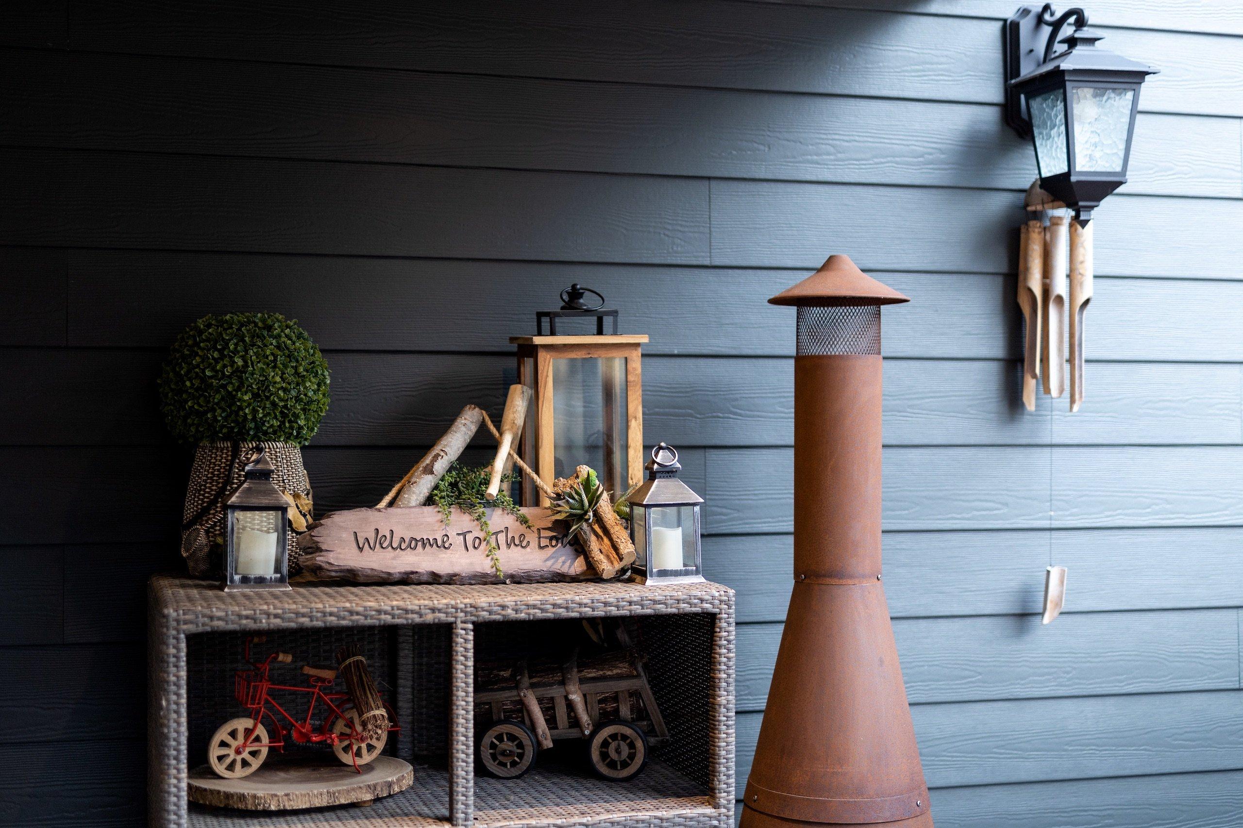 Entry way with a shelving unit full of knick knacks