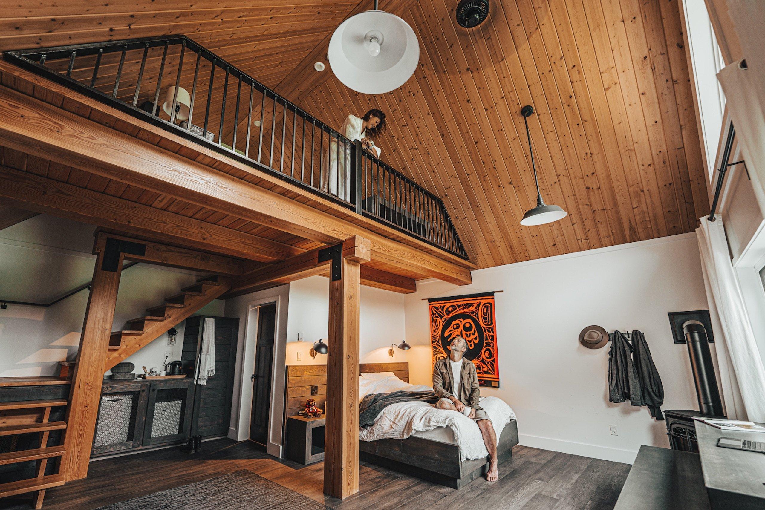 A couple in a lodge looking at each other from separate levels