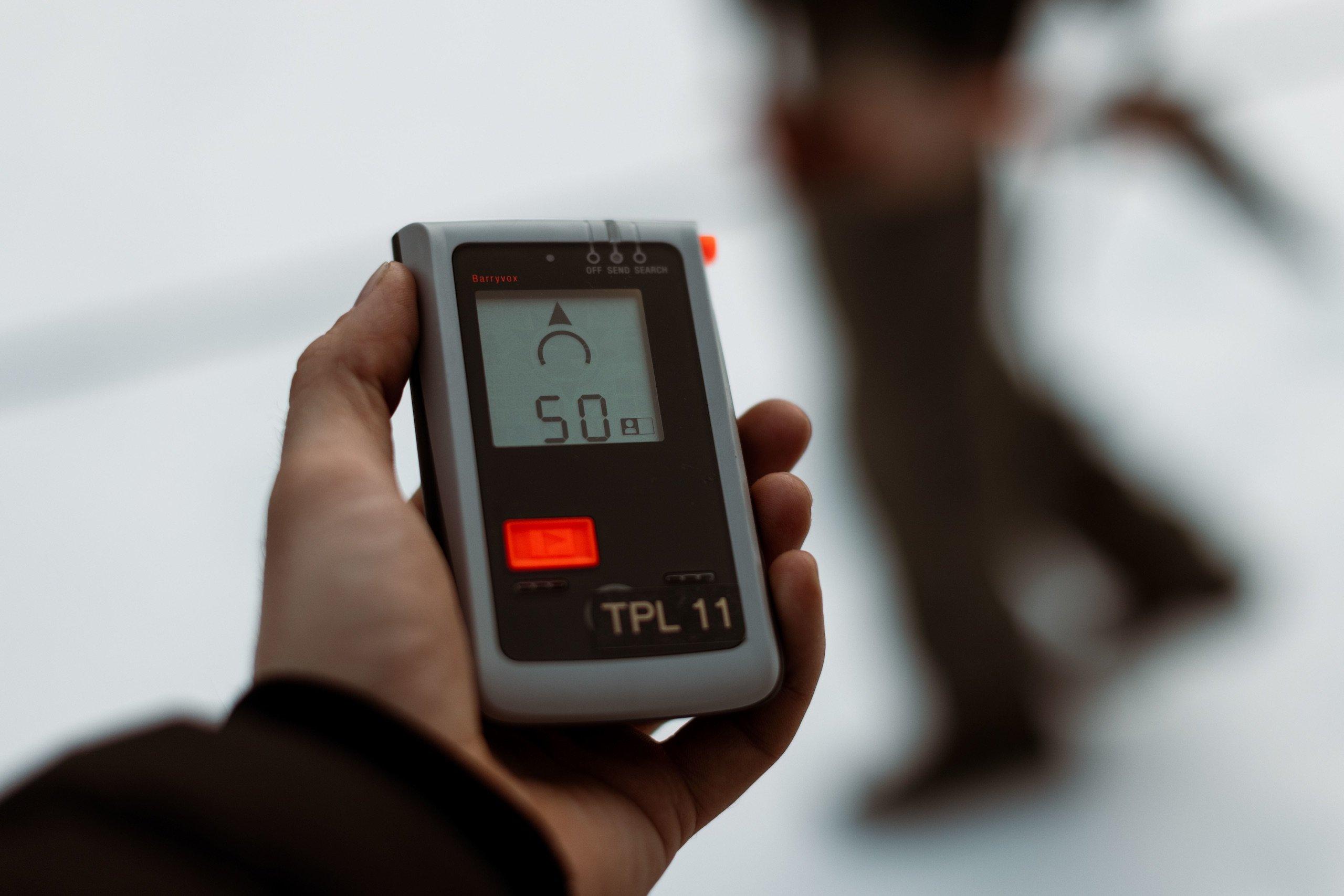 A person holding a monitor