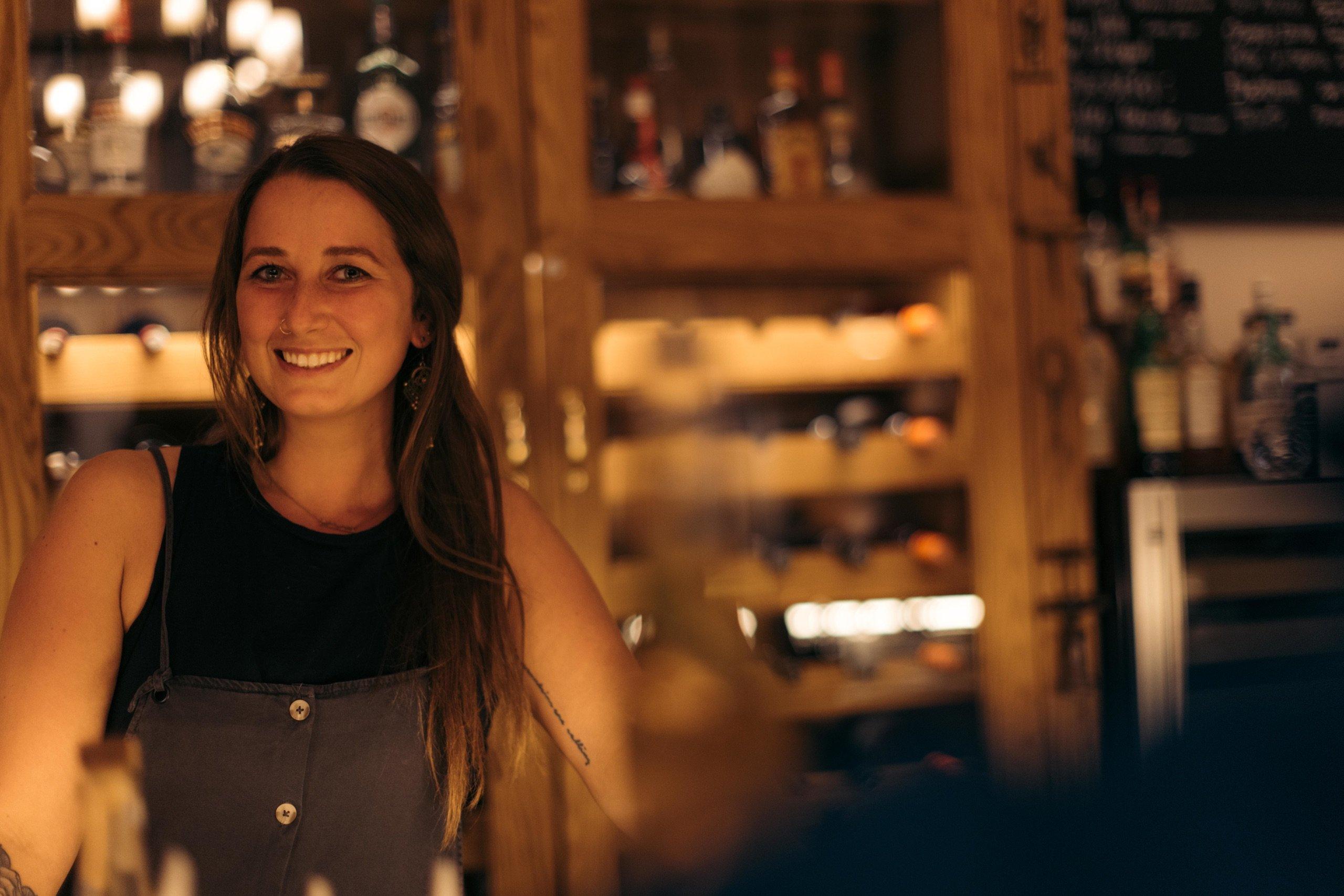 A woman bartending