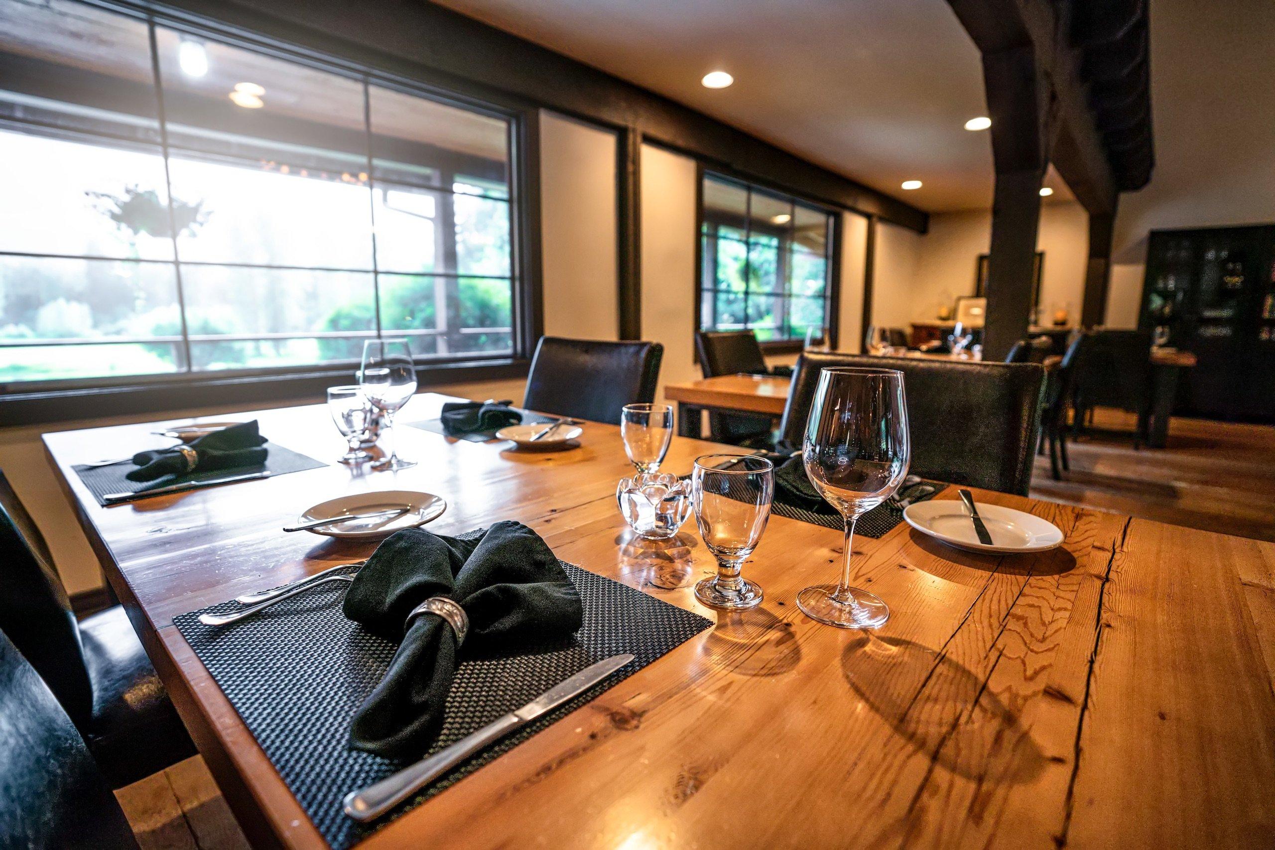 Small dinner table with place settings for four